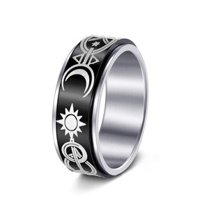 Detail of rotating spinner ring with sun moon motifs and black enamel finish