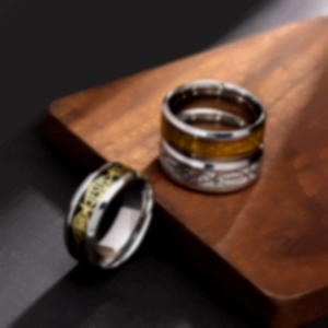 Set of three stainless steel rings for men including a golden Celtic dragon inlay design