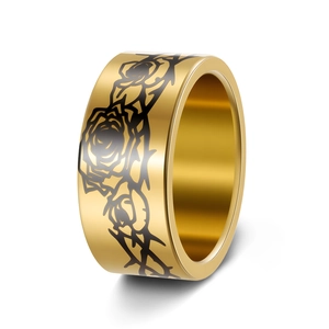Detailed view of 10mm gold stainless steel ring with black rose and thorn gothic patterns