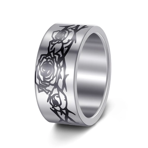 Close-up of 10MM stainless steel ring with black laser-engraved rose and thorn patterns