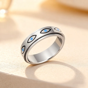 Polished stainless steel evil eye spinner ring for stress relief with rotating design