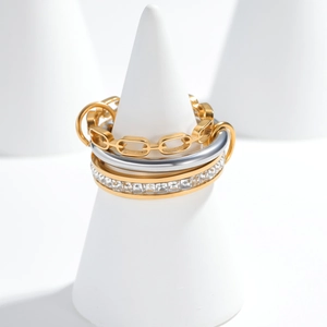Three-piece layered ring set featuring gold chain, silver band, and square zircon stones