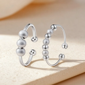Silver rotating bead anti-anxiety fidget ring with adjustable open band for stress relief