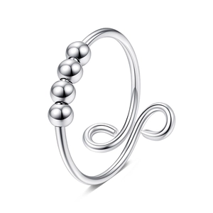 Detailed view of silver rotatable beads on adjustable anxiety ring for stress relief