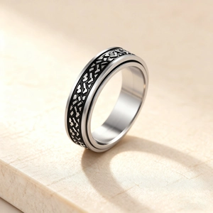 Rotating stainless steel spinner ring for men with black geometric crushed stone pattern