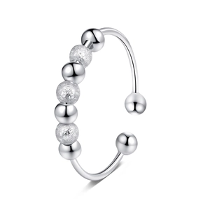 Detail of adjustable silver fidget ring with mixed polished and frosted beads