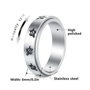6mm brushed stainless steel spinner ring with four black turtles on a rotating band