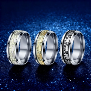 Detailed row of stainless steel crown rings in silver, gold, and black with punk style