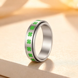 Rotating stainless steel stress relief ring with green four-leaf clover enamel design