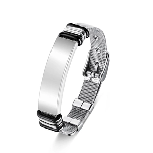 Detailed macro view of woven stainless steel mesh bracelet with polished engravable plate