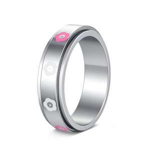 Detail of silver spinner ring featuring rotating band with pink and white flower charms