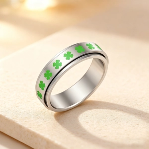 Silver spinner ring with green four-leaf clover pattern in 304 stainless steel