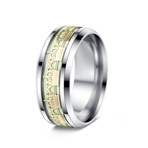 Close-up of luminous crown pattern embossed on a vintage stainless steel band ring