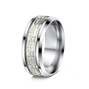Detailed side view of glowing crown ring in silver stainless steel with luminous inlay