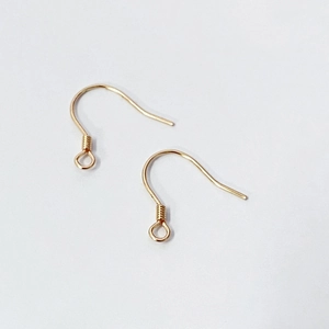 Detailed macro shot of golden S925 sterling silver earring hooks for DIY jewelry making