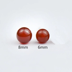 Detailed size comparison of 8mm and 6mm red agate stud earrings in S925 silver