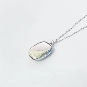 Detailed macro view of S925 sterling silver rectangular locket with polished finish
