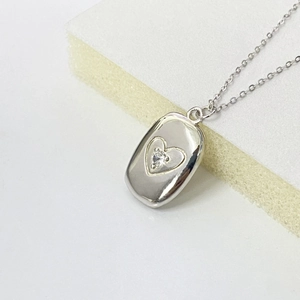 Polished silver S925 necklace with a rectangular locket pendant and heart shaped zircon