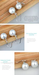 Detailed close-up of S925 sterling silver earrings featuring elegant round shell pearls