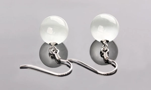 Close-up of S925 sterling silver drop earrings with translucent cat eye stone beads