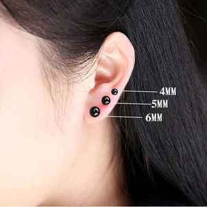 Detailed comparison of 4mm, 5mm, and 6mm black onyx stud earrings on a model ear