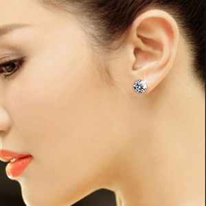 Classic S925 sterling silver four-prong stud earrings with brilliant zircon on ear