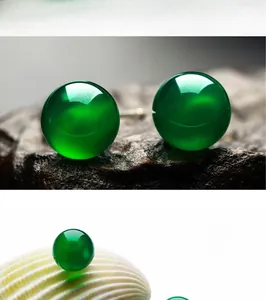 Macro detail of round green chalcedony stud earrings with S925 sterling silver posts