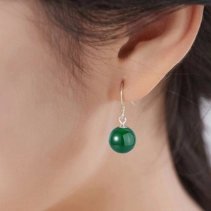 Close-up of S925 sterling silver earring with a round green chalcedony bead worn on ear