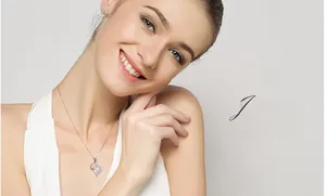 Close-up of heart-shaped 925 silver pendant with large sparkling zircon on a delicate chain