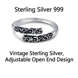 Vintage 999 sterling silver adjustable ring with intricate black engraved patterns