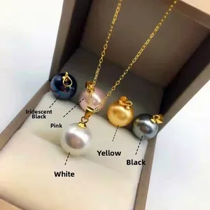 Detail view of five round pearl pendants in white pink gold grey and black shades