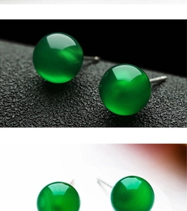 Macro shot of sphere green chalcedony studs on silver pins with polished finish