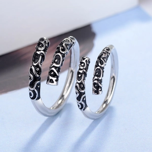Macro detail of 925 silver Monkey King ring featuring vintage cloud pattern engraving