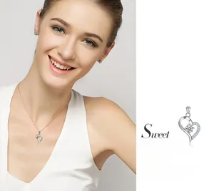 Detailed view of a 925 sterling silver heart pendant necklace with shimmering zircon stones