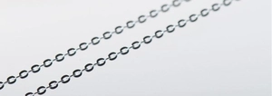 Macro shot of 1.5mm S925 sterling silver cable chain with polished links detail