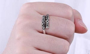 Close-up of vintage 925 sterling silver ring with engraved traditional cloud patterns
