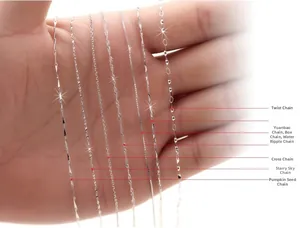 Detailed macro view of seven different S925 sterling silver chain styles on a palm