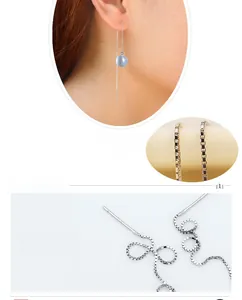 Détail macro de boucles d'oreilles traversantes en argent S925 et pierre œil de chat