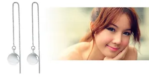 Détail de longues chaînes d'oreilles en argent S925 avec perles élégantes en œil de chat