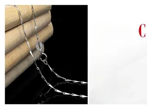 Detail shot of a S925 sterling silver melon seed chain necklace with spring clasp and tag