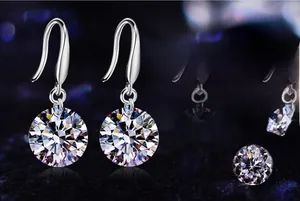 Macro shot of 925 sterling silver fishhook earrings with a large round cubic zirconia