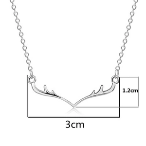 Detailed view of silver antler pendant with measurements 3cm width and 1.2cm height