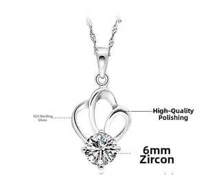 Detail view of heart wing sterling silver pendant with a 6mm round cubic zirconia