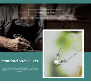 Detail of S925 sterling silver reindeer antler necklace with a freshwater pearl pendant