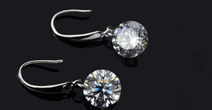 Detail view of 925 sterling silver hook earrings with brilliant round cut cubic zirconia