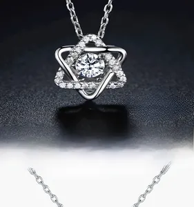 Macro detail of 925 sterling silver hexagram necklace pendant with sparkling center stone
