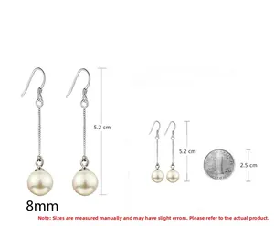 Detail view of 8mm white pearl earrings with 5.2cm long silver drop chain and hooks