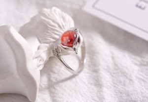 Close-up of S925 silver fox open ring with red gemstone and sparkling zirconia