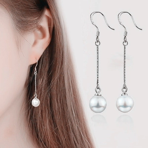 Detail of 925 sterling silver ear hook with natural pearl drop and hallmark