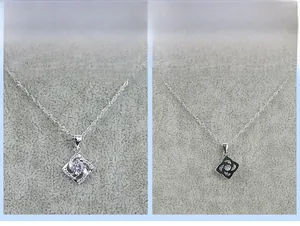 Detailed front and back view of S925 sterling silver clover pendant with central diamond